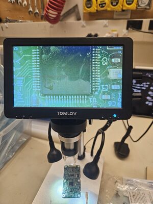 Board inspection under the microscope.